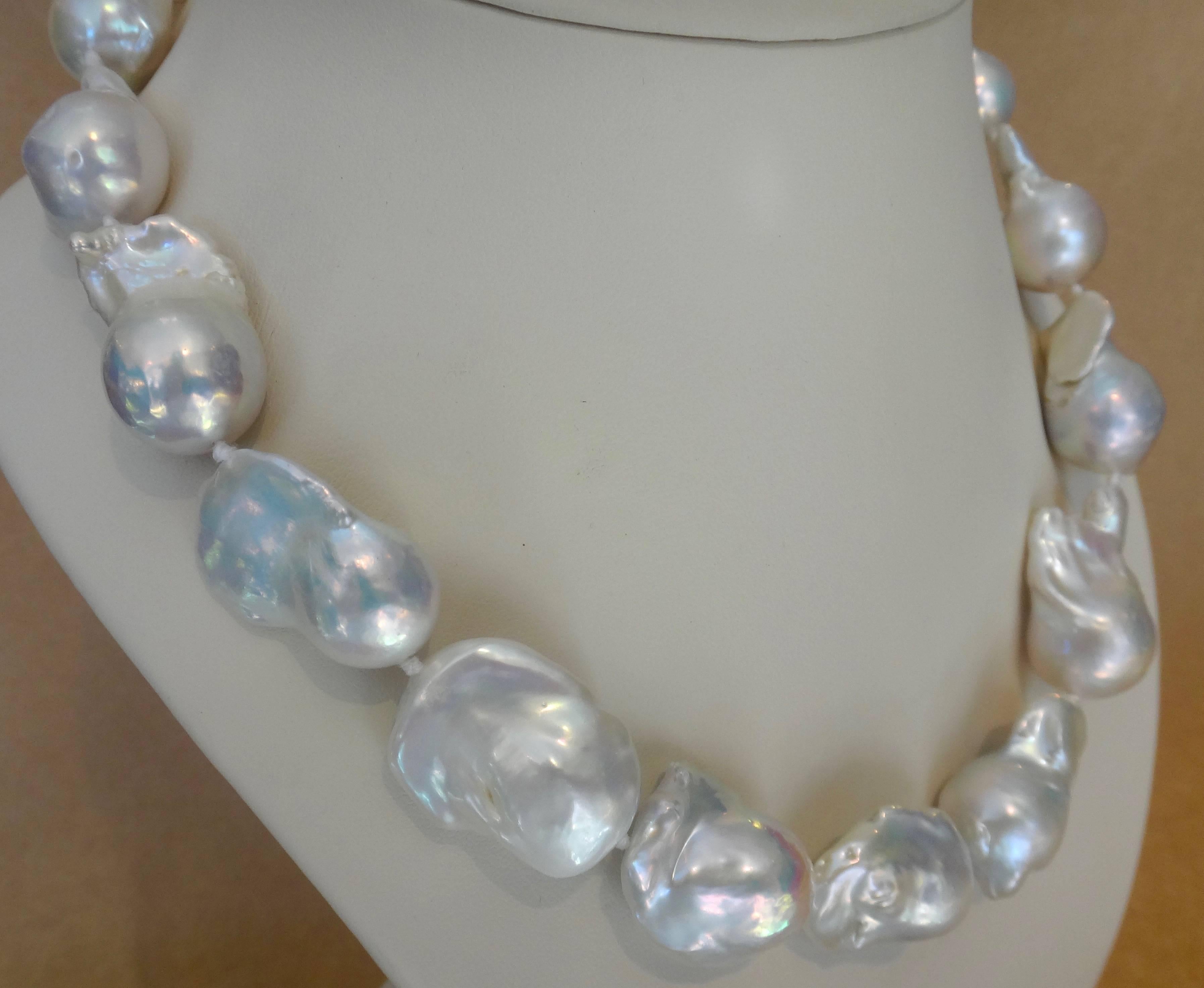 Ginormous Cloud Pearls graduating from a center of 32 x 23mm to 22 x 17mm, comprise this necklace.  The pearls are baroque in shape and possess wonder reflected colors and luster. Measuring 19 inches long, the necklace is finished with a jumbo