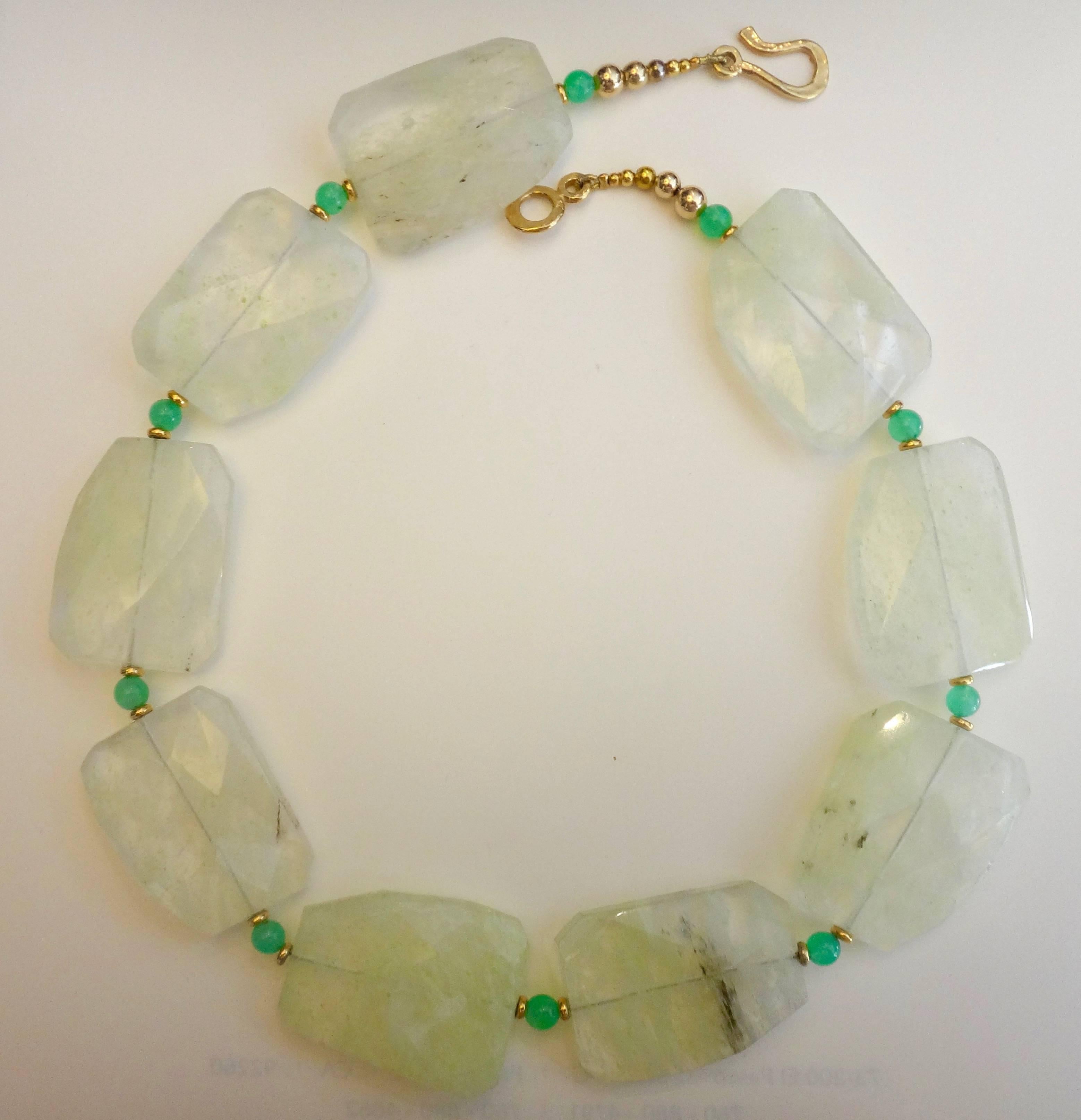 Irregularly shaped and faceted light green quartz beads are paired with green chrysophrase in this dramatic necklace.  Gold spacer beads add depth and interest.  The necklace measures 21 inches and is finished with a hammered vermeil hook clasp.  
