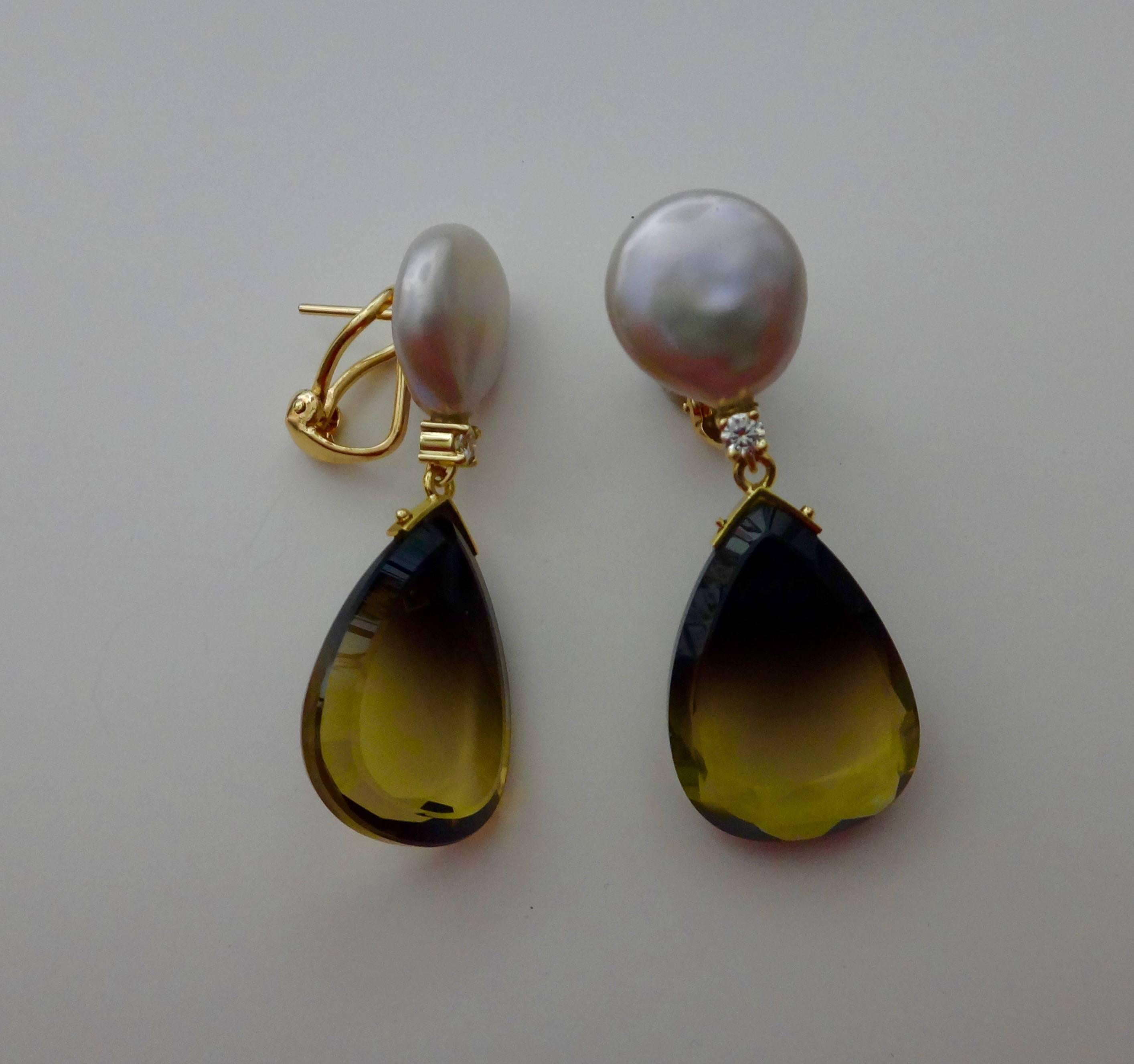 Pear shaped slices if bi-color quartz graduated in color from espresso to canary yellow drop from pale gray coin pearls and diamonds in these dangle earrings.  The gems are faceted around the edges to add further sparkle.  The earrings have post