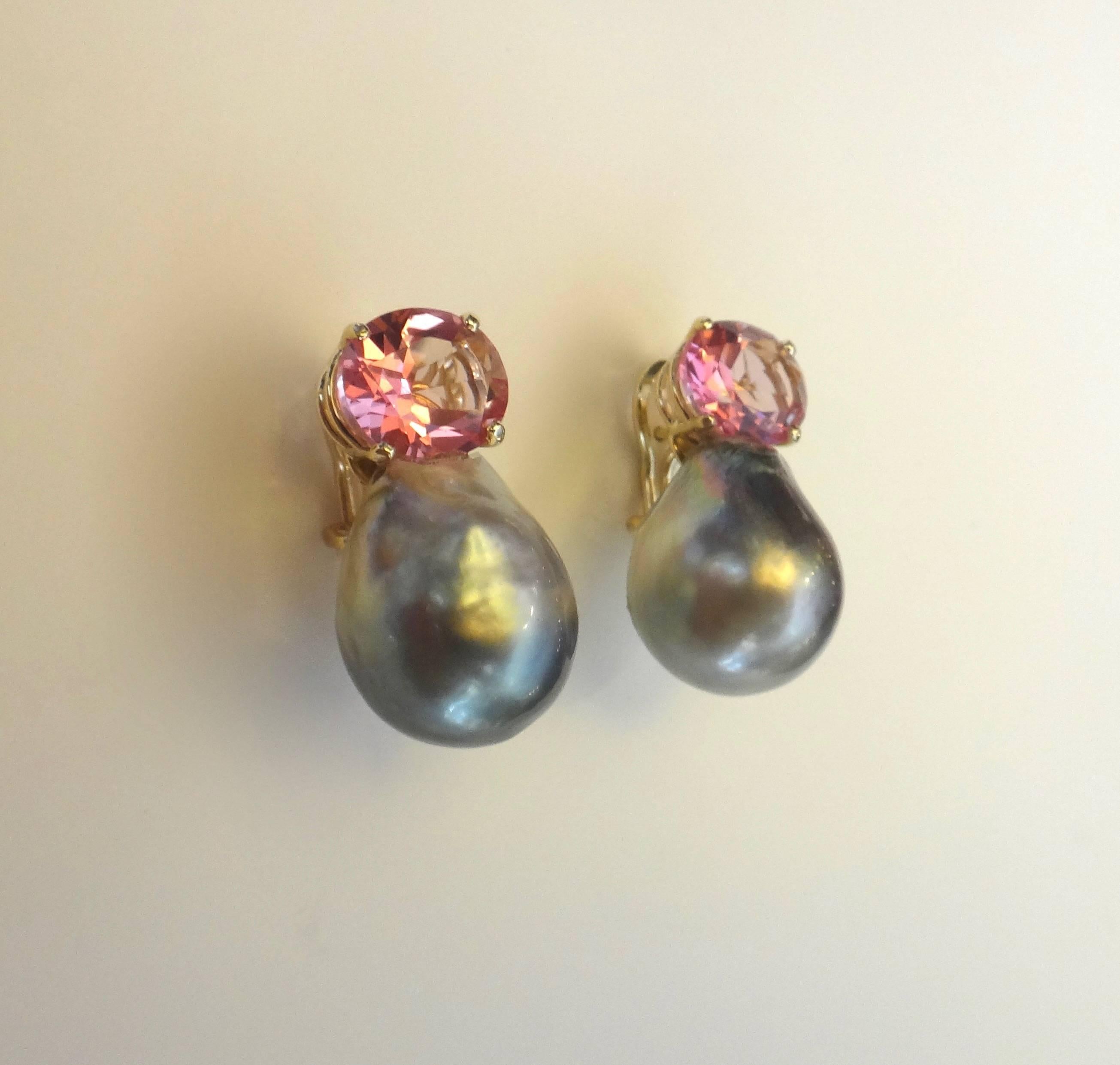 A perfectly matched and delicately colored pair of baby pink topaz are combined with an enormous pair of modeled gray baroque Tahitian pearls in these exciting earrings.  Simply set in hand fabricated settings, the earrings have posts with omega