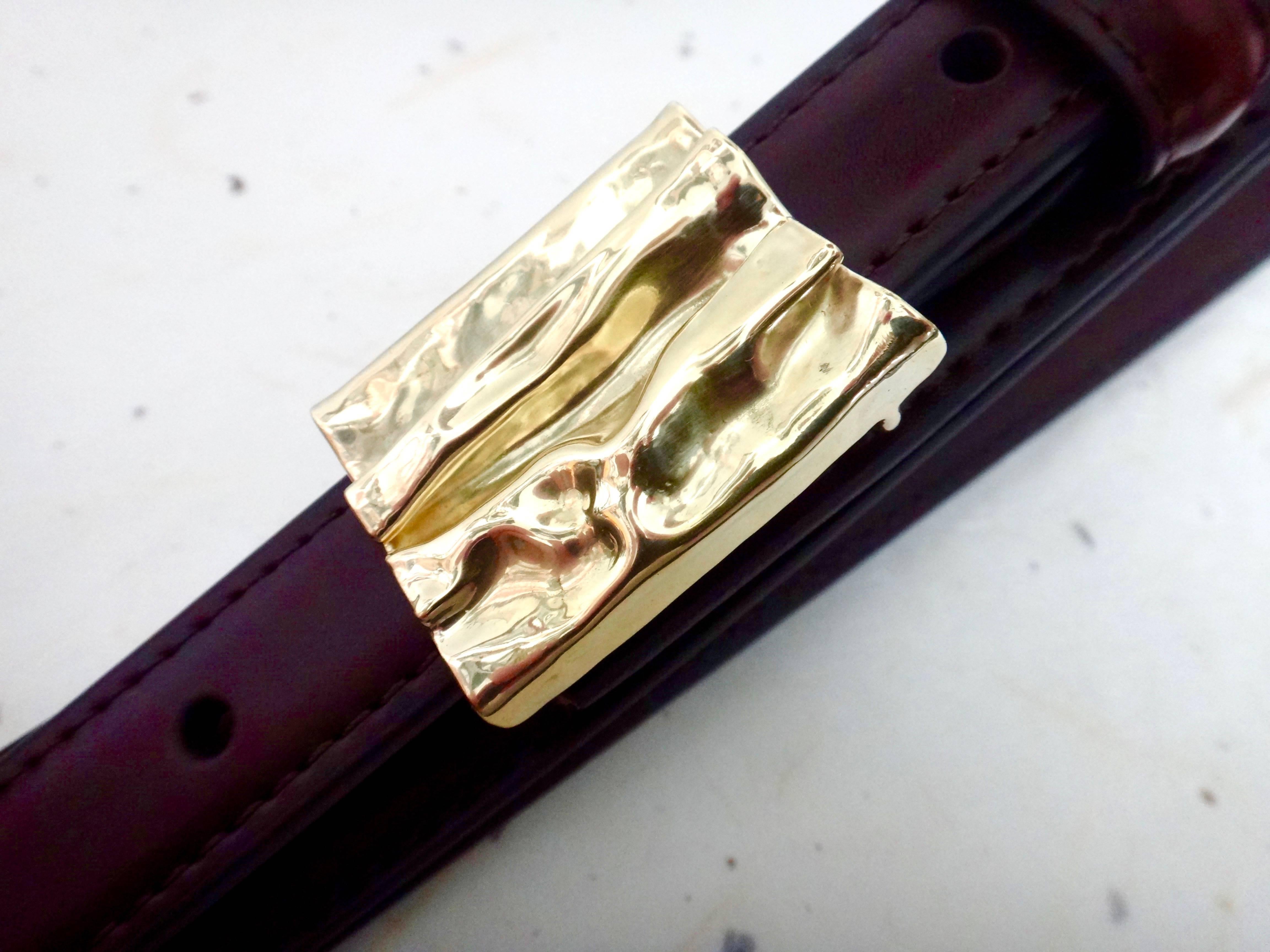 Michael K. Jewels iconic "Folded Gold" concept is reinvented in this 18k yellow gold belt buckle.  This one-of-a-kind fabrication is shown on a 38 inch (36 inch waist) brown leather Ranger Belt, included with the purchase of this piece.  