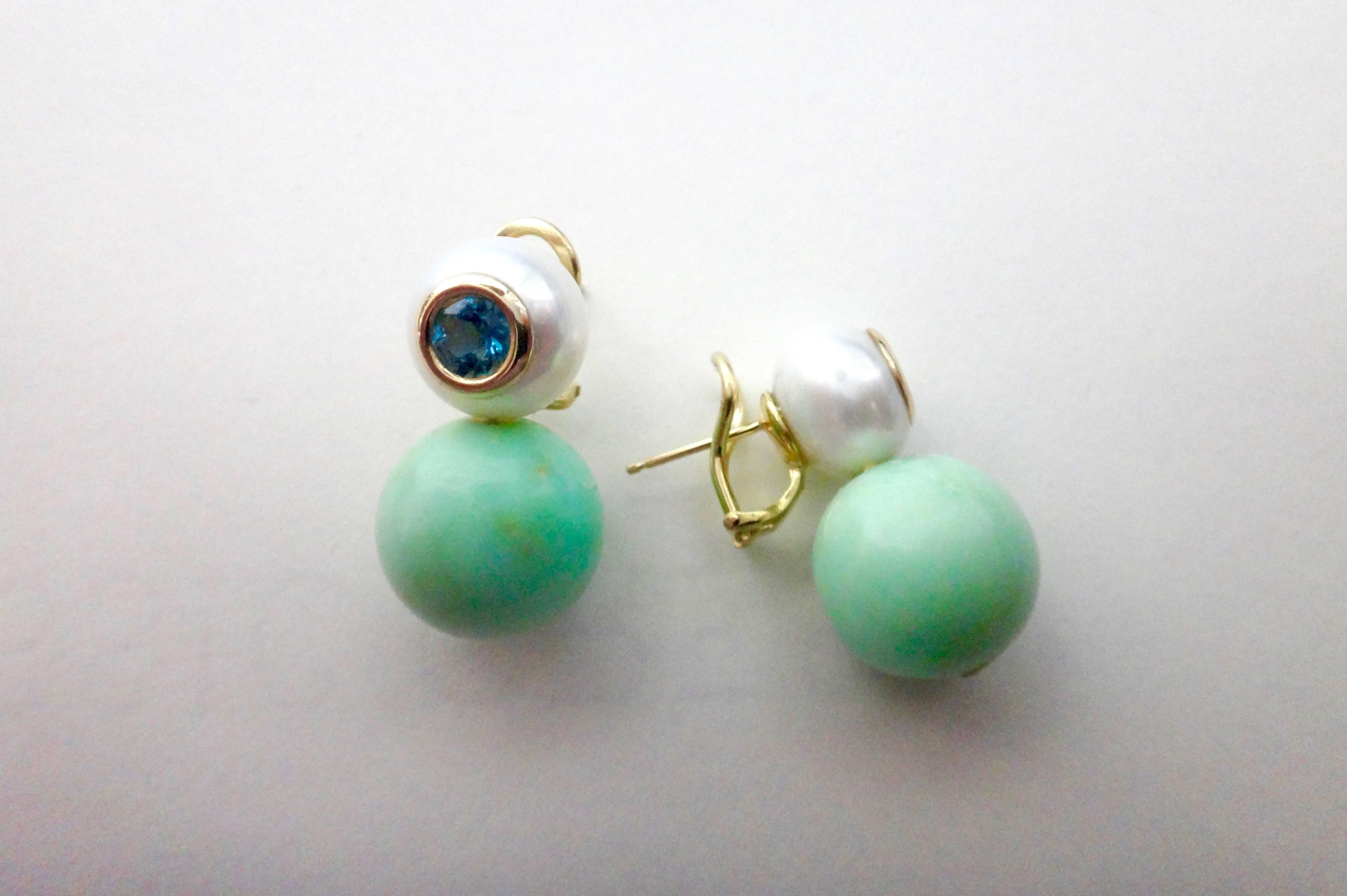 Chrysoprase spheres measuring 16mm are complimented with 13mm button shaped South Seas pearls decorated with bezel set blue zircons.  Chrysoprase is a gemstone variety of chalcedony (a cryptocrystalline form of silica) that contains small quantities
