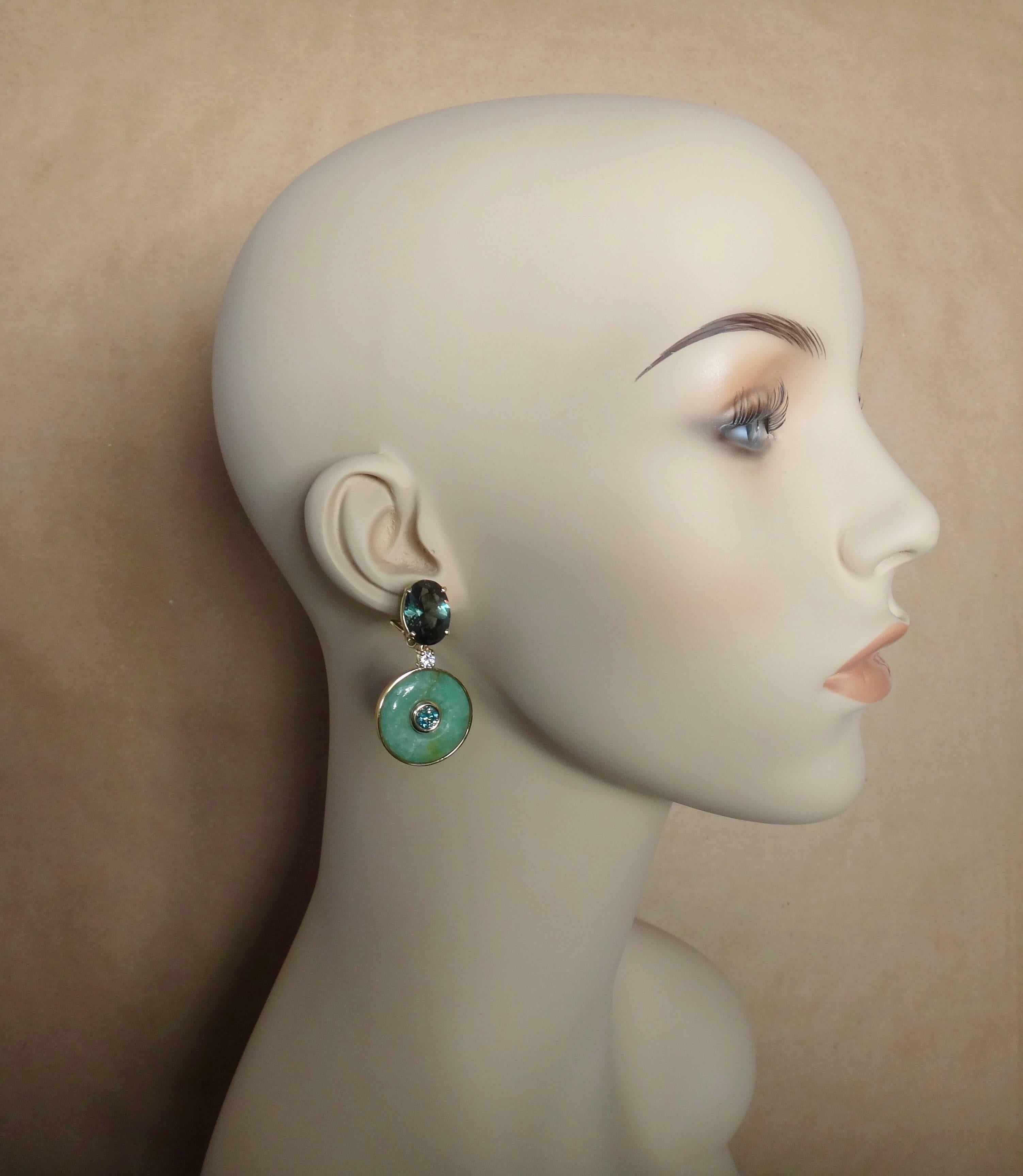Carved discs of green Burmese jadeite are the hallmark of these dangle earrings.  (In Chinese, jade is known as 