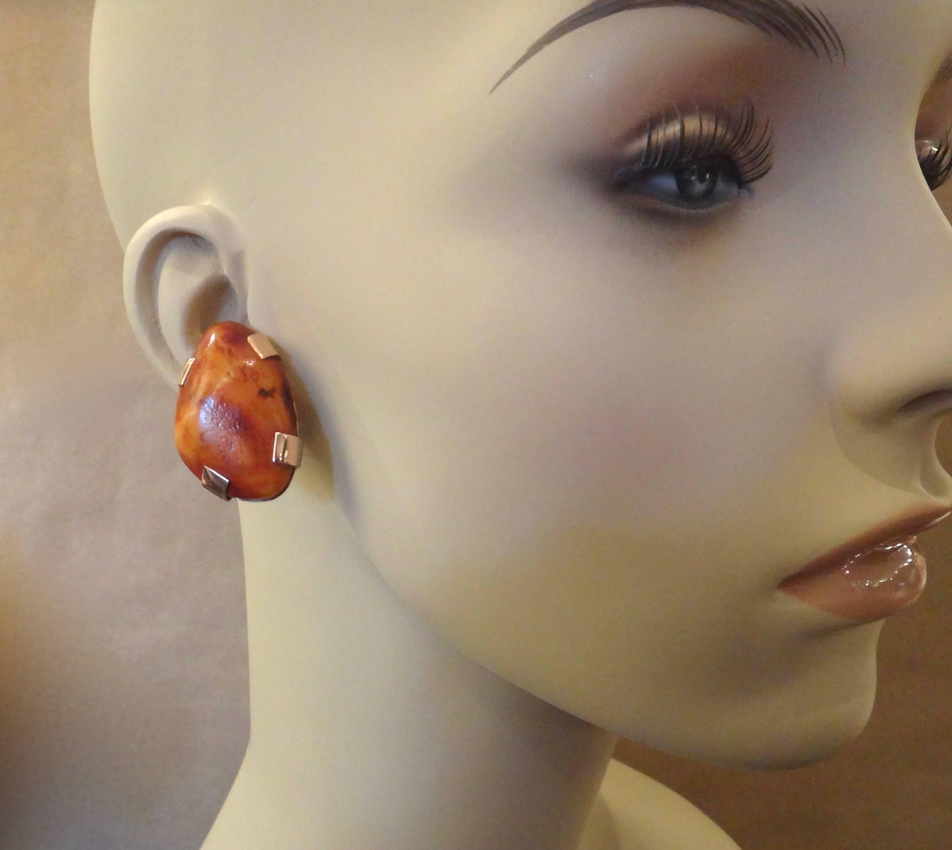 Large nuggets of butterscotch colored Baltic amber are set in hand fabricated rose gold mounts.  The dramatic yet versatile earrings have posts with omega clip backs for comfort and safety.  