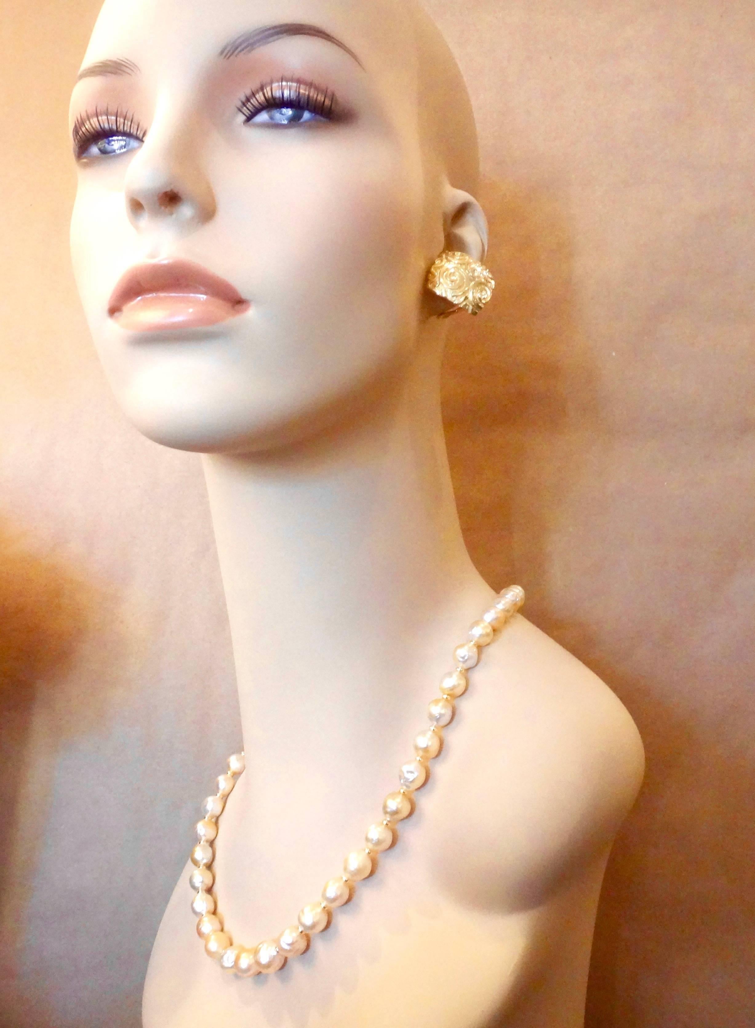 Forty baroque Golden Indonesian pearls make up this stunning necklace.  The pearls possess great color and luster .  They range in size from 9mm to 11mm with a finished length of 20 inches.  The pearls a spaced with small gold rondelles and the