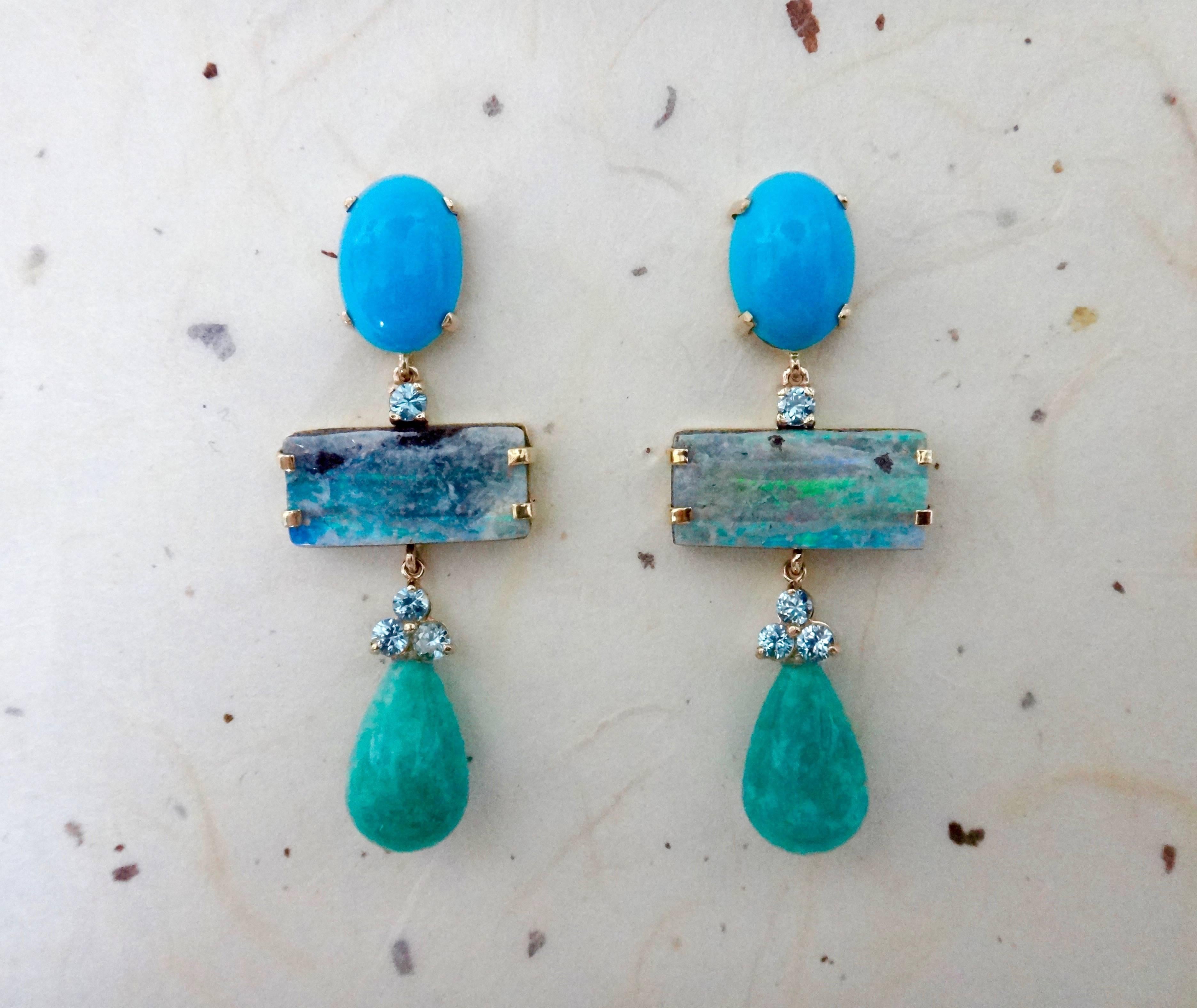 Sleeping Beauty turquoise forms the anchors for these monochromatic dangle earrings.  Complimenting the turquoise are brilliant cut blue zircons (Myanmar), Boulder Opals (Boulder opal is one of the most valuable varieties of opal, second only to