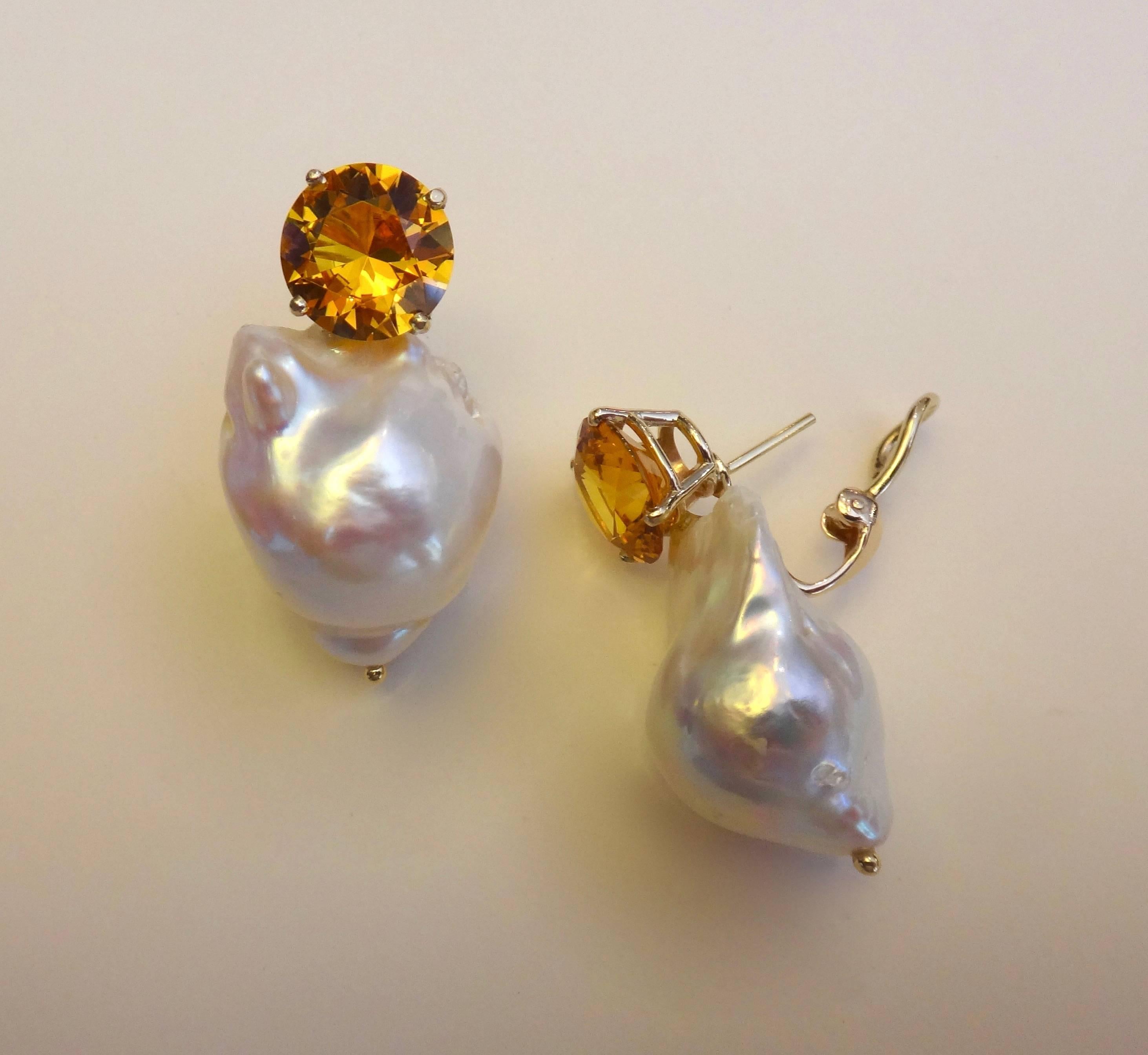 A perfectly matched pair of golden citrines are paired with a ginormous pair of white baroque cultured pearls in these dramatic earrings.  Simply set in hand fabricated settings, the earrings have posts with omega clip backs.