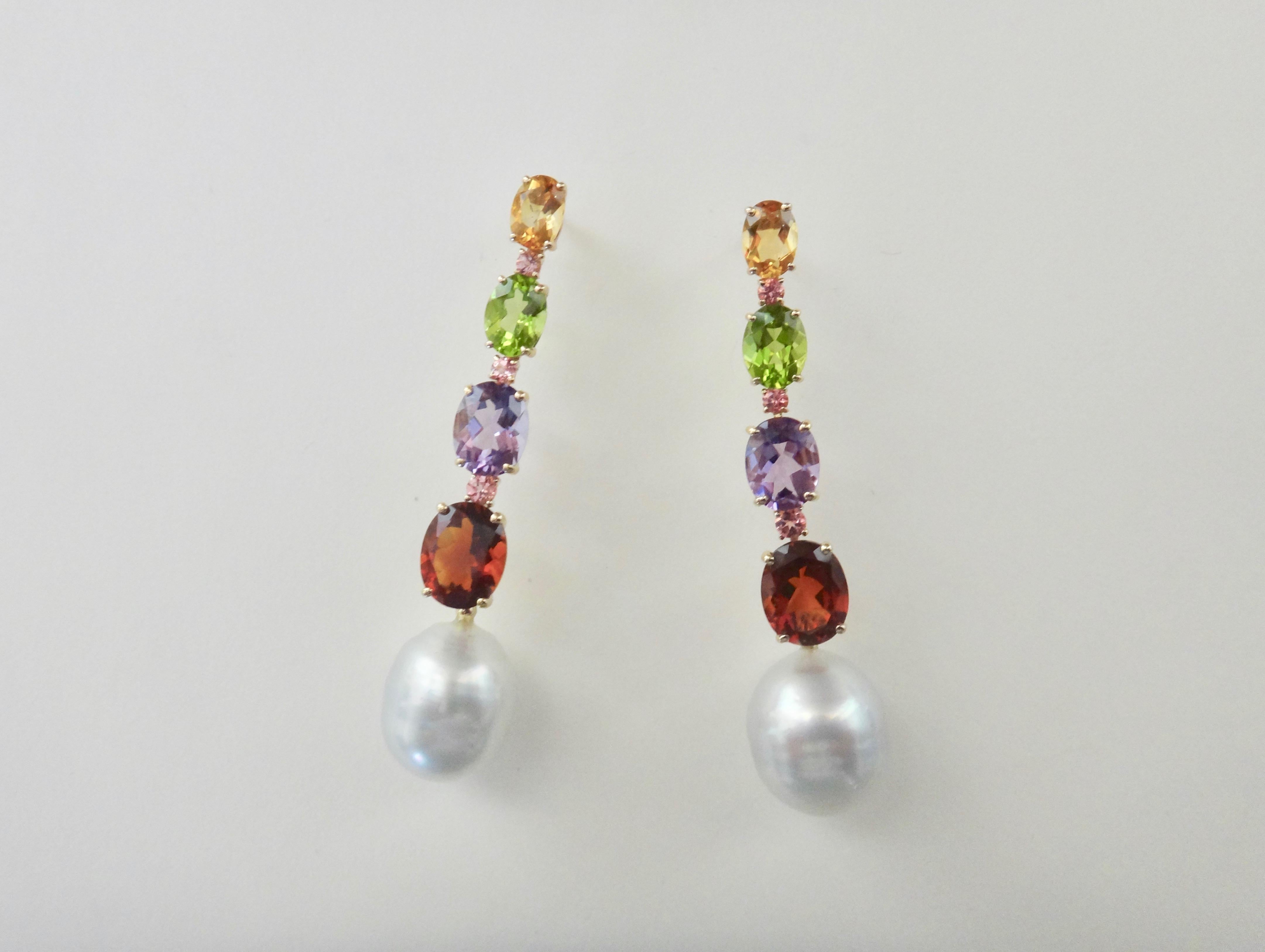 Citrine, peridot, amethyst and garnet are oval cut, graduated in size and spaced with round pink tourmalines in these delightful dangle earrings.  Completing the dangles are a pair of baroque, gem quality Paspaley South Seas pearls.  The mountings