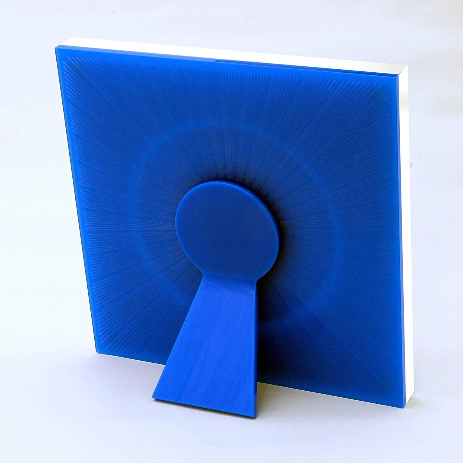 Model Sharing is a limited edition of Art with Heart collection of photoframes by Laura G , Italy. It is realized into metacrylates royal blue and White, with guillochè
rays handworked into metacrylate , giving light to the Whole piece.
Sharing