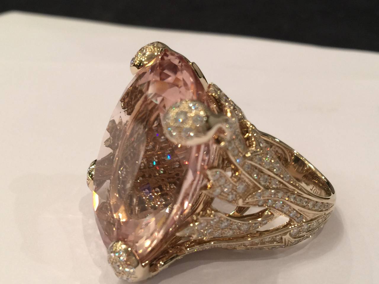 A natural gold Christian Dior ring set in the middle with a magnificent oval, light pink peach flower color morganite. The 