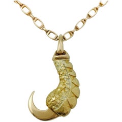 Yellow Gold Cartier "Eagle Claw" Pendant on a Cartier Gold Chaine