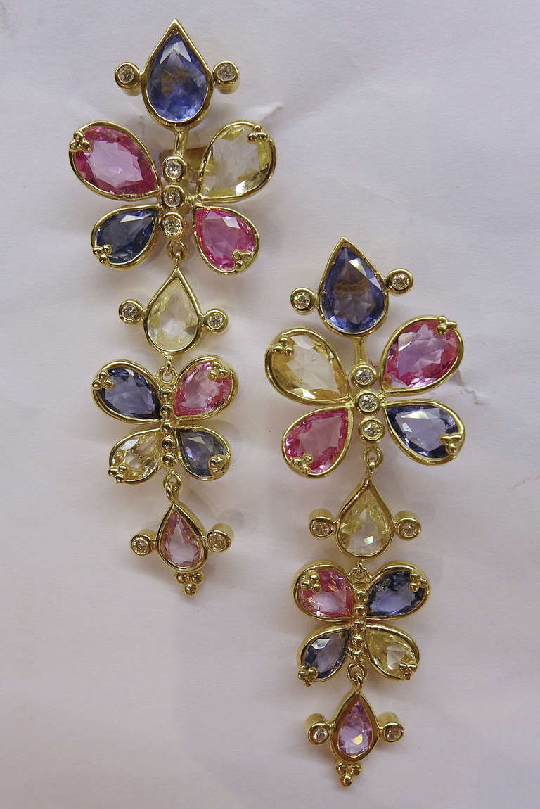 Yellow gold Temple St. Clair earrings, like butterfly set with pear-shaped blue, yellow and pink sapphires; small brilliants are decorating the length. 
Length: 55 mm
Total weight of sapphires : approximately 25 carats.
Circa 2000