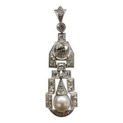 1920's platinum pendant set with old european cut diamonds and a pearl.