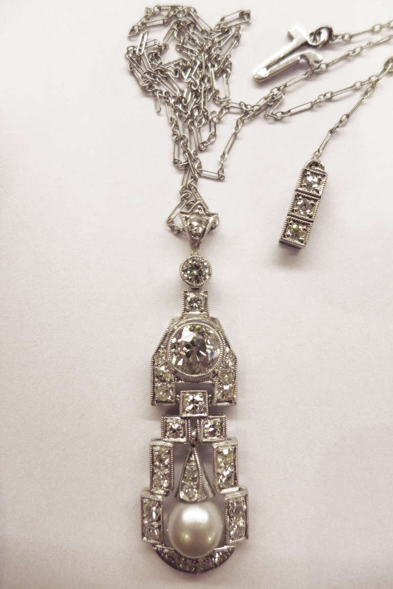 Art Deco 1920's platinum pendant set with old european cut diamonds and a pearl. For Sale