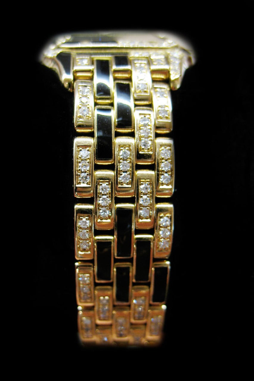 Exceptional 18k yellow gold Cartier wristwatch from the Panther collection. The bracelet and the watch are decorated to represent a panther's coat. The case, the dial, the bezel, the bracelet are set with diamonds and black enamel.
Width: 20