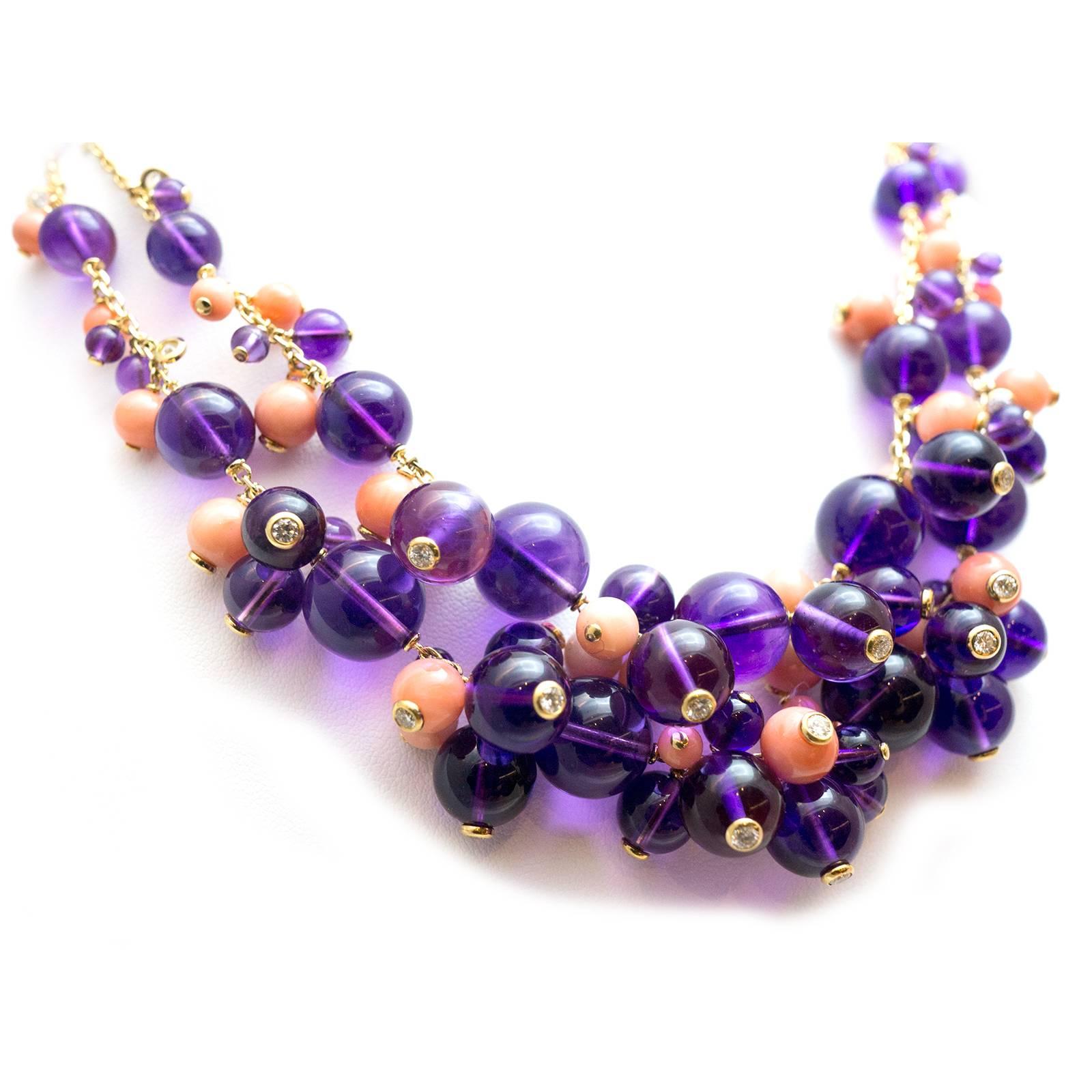 Coral, amethyst and diamond 18Kt yellow gold necklace, 'Les Delices de Goa', signed by Cartier.
This is a double string necklace set with polished coral and amethyst beads accented with brilliant-cut diamonds, signed Cartier, numbered, French assay