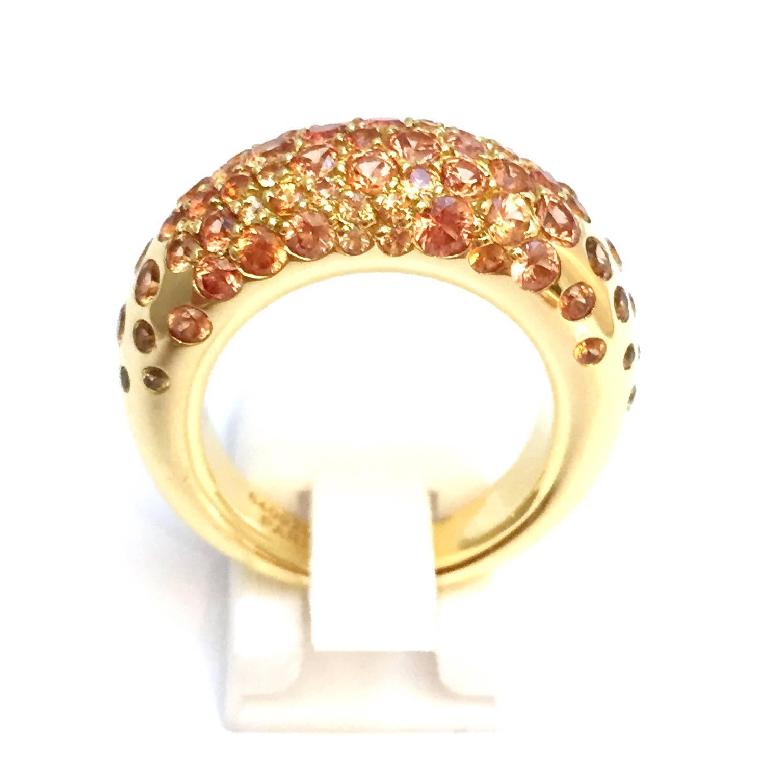 A 750/000 yellow gold Chaumet ring "Caviar" collection set with orange sapphires. 
Width: 10 mm. 
Finger size : 7,5 can be sized for more or less two sizes. 
Retail price : €12,250 