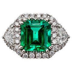 14K White Gold Ring with 4.46 Ct. Emerald and Diamonds. (Size 8.25)