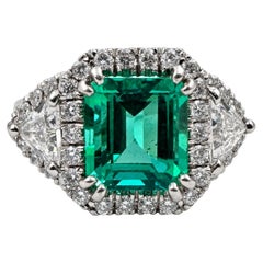 14K White Gold Ring with 4.46 Ct. Emerald and Diamonds. (Size 8.25)