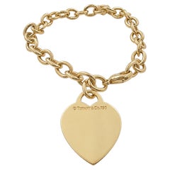Tiffany & Co. 18K Yellow Gold 6.75" Heart Tag Charm Bracelet.