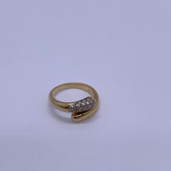 Vintage-Ring von Bvlgari: „Astrea“ mit Pavé-Diamanten, 18 Karat Gelbgold, Schlangenmotiv, Bypass-Ring