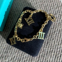 TIFFANY & CO 18K Yellow Gold Atlas 5 Charm Bracelet Roman Numeral Vintage