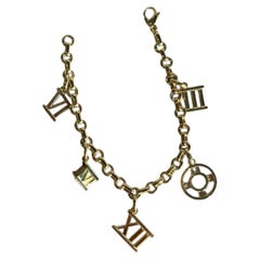 TIFFANY & CO 18K Yellow Gold Atlas 5 Charm Bracelet Roman Numeral Vintage