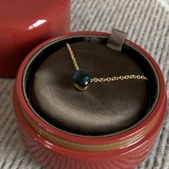 Coffret comprenant un collier Pomellato Nudo en or rose 18 carats avec pendentif en topaze bleue de Londres