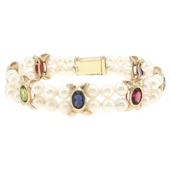 Zweisträngiges Armband aus Akoya-Zuchtperlen mit in Zargen gefassten Granaten, Citrinen und Peridoten