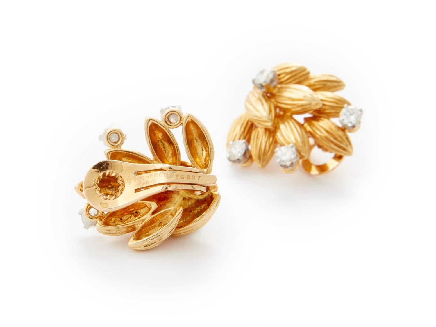 Boucheron Earrings (with clips), ca. 1970, shaped foliage bouquet embellished with brilliant-cut diamonds, stamped 'BOUCHERON PARIS' and french hallmark

18k gold with diamonds