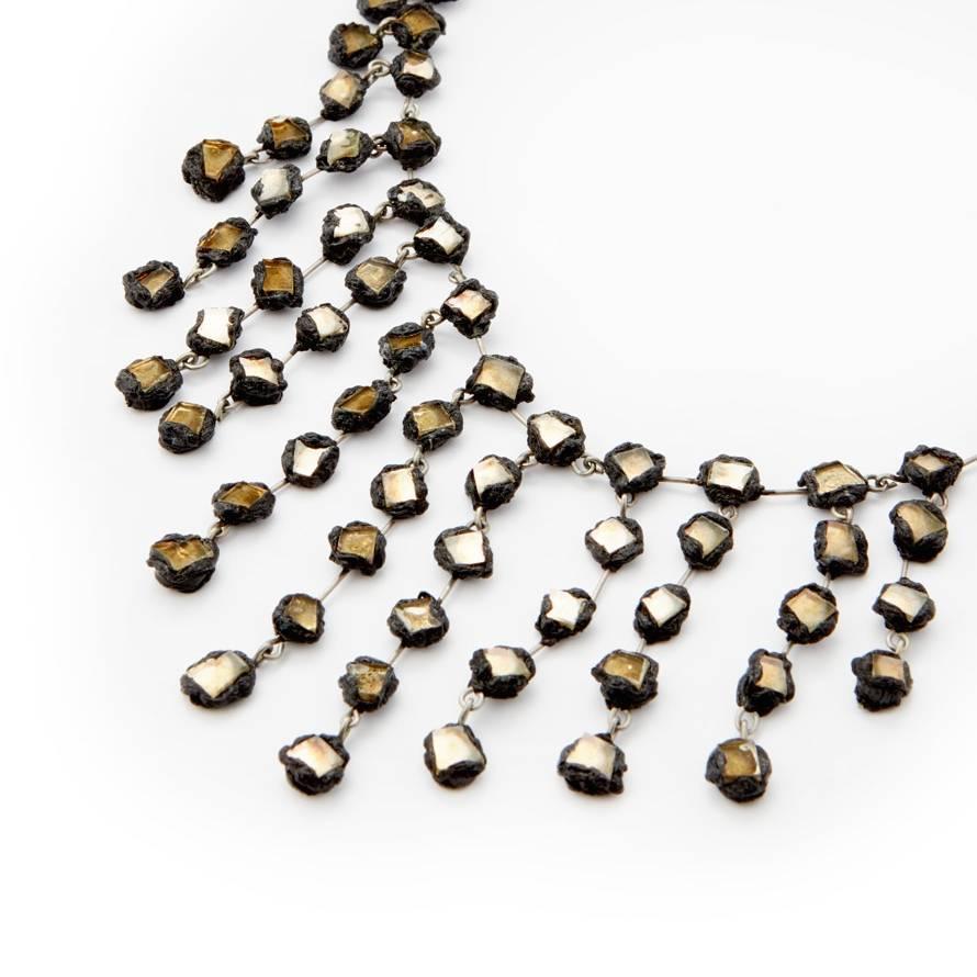 Line Vautrin, Untitled Cascading Necklace, ca. 1960, talosel resin, mirror fragments, unique.

Line Vautrin (1913-1997) French artist, jewellery and designer worked in a range of experimental mediums including resin, glass and bronze taking the