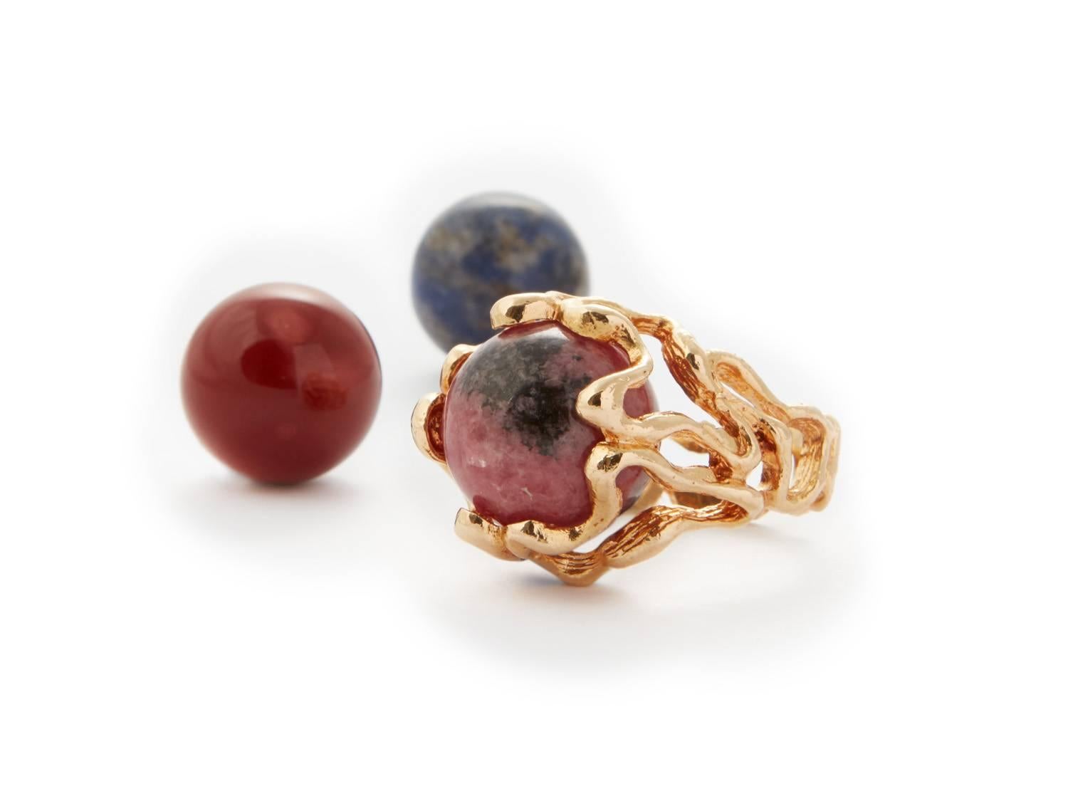 Gilbert Albert, Untitled Ring with 7 Interchangeable Gemstones, ca. 1970, stamped with makers mark 'GA' and eagle's head on the underside, 18k gold ring plus 7 interchangeable gemstones, including rose quatrz, lapis lazuli, tiger's eye, carnelian,