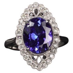 Anello in platino con tanzanite blu-viola reale da 3,44 carati e diamanti, forma ovale marquise