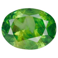 0.98 ct, Certified Russian faceted vivid apple green oval demantoid garnet