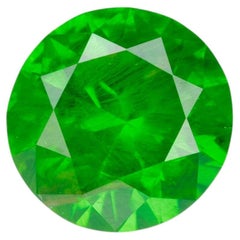 0.55 ct, Faceted Russian demantoid garnet with horsetail inclusion