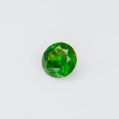 0,38 ct, granato demantoide russo sfaccettato con byssolite inclusioni