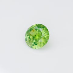 0,56 ct, facettierter russischer Demantoid-Granat mit Byssolit-Einschlüssen