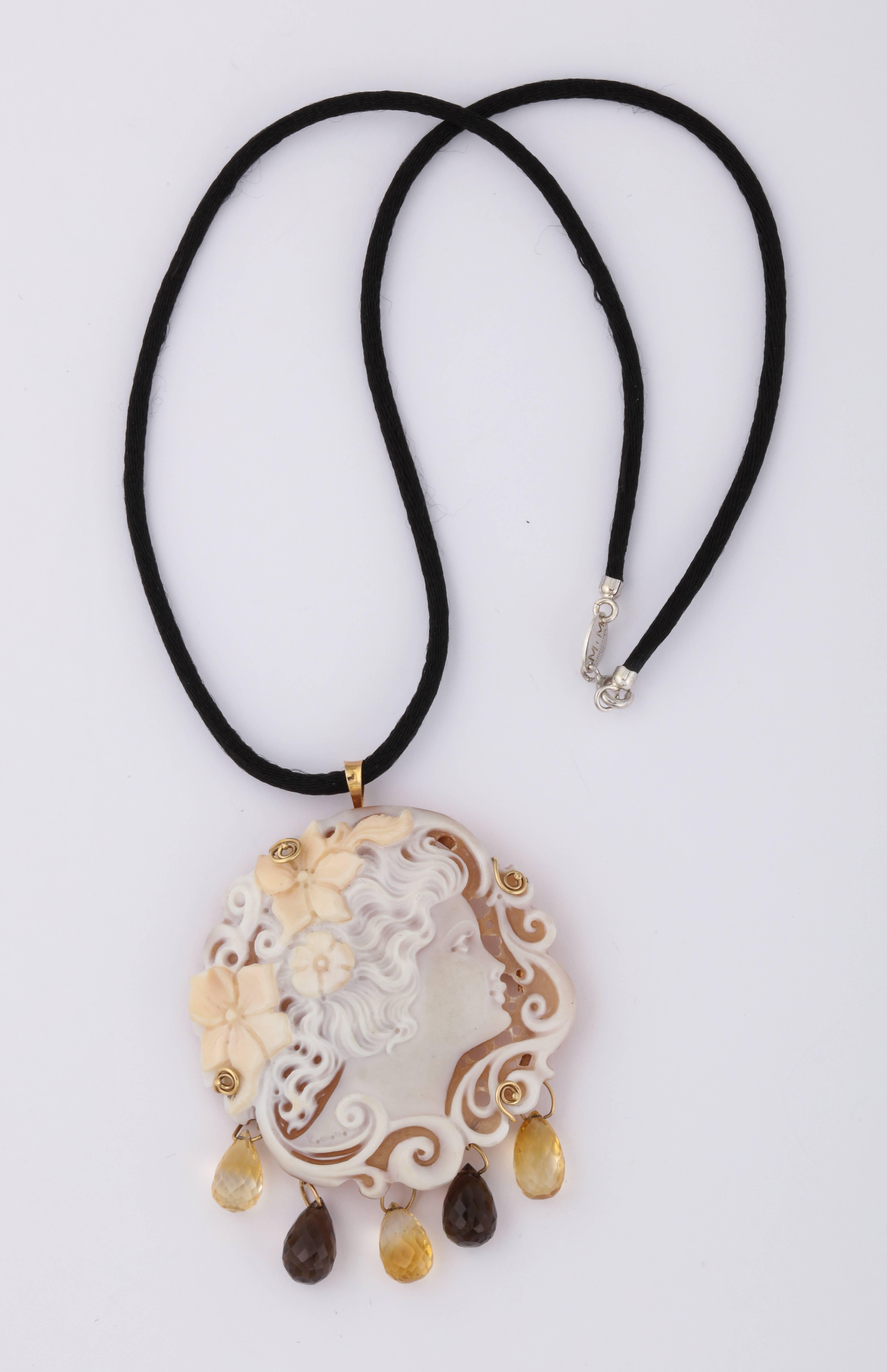 Hand carved sardonyx shell set in 14Kt gold pin/pendant with citrine and smokey quartz drops.