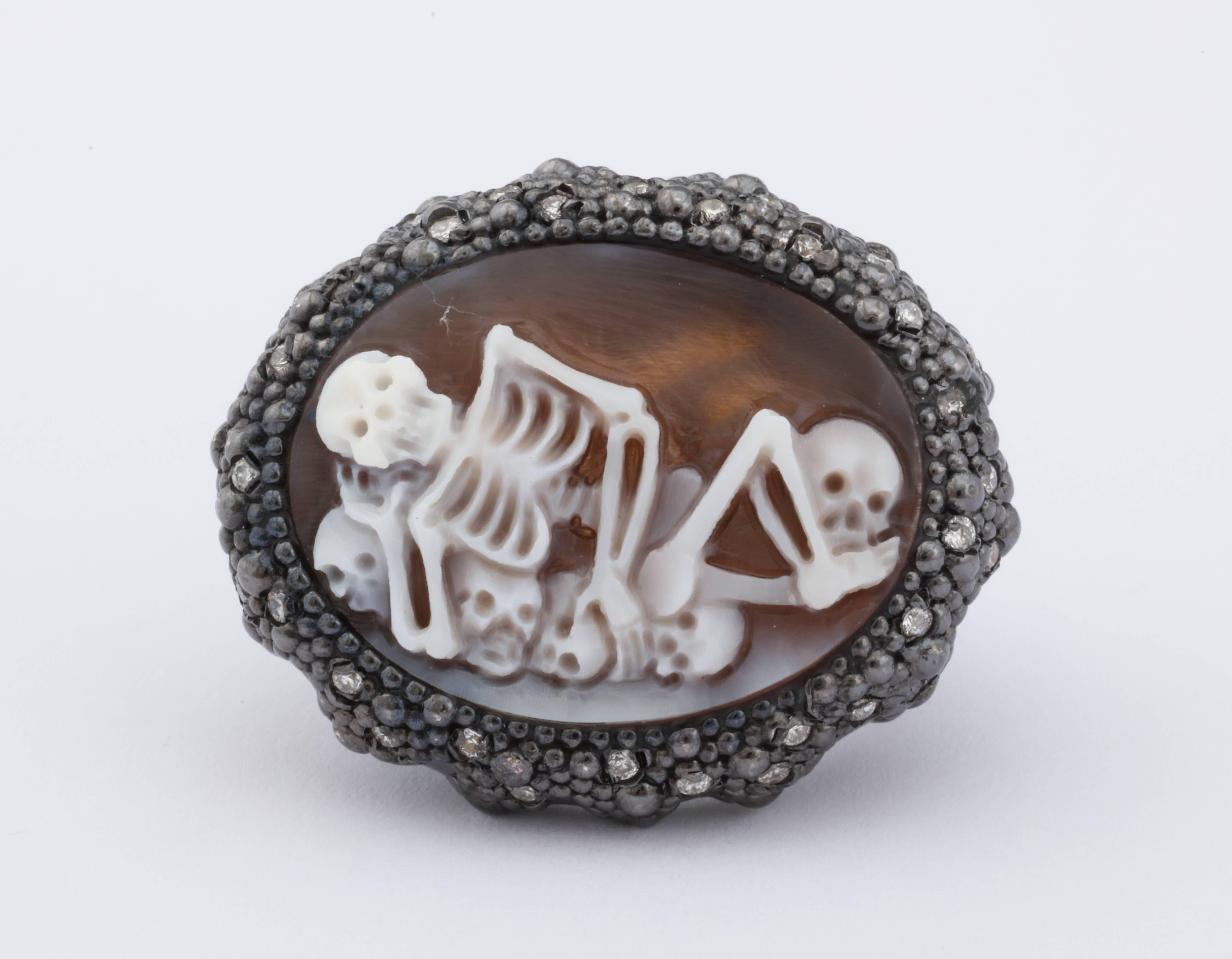 25mm sardonyx shell cameo hand-carved, set in sterling silver black rhodium plated ring with white diamonds.
Ring Size: US6

*Being these are hand crafted one of a kind designs, not all ring sizes might be immediately available. We offer custom