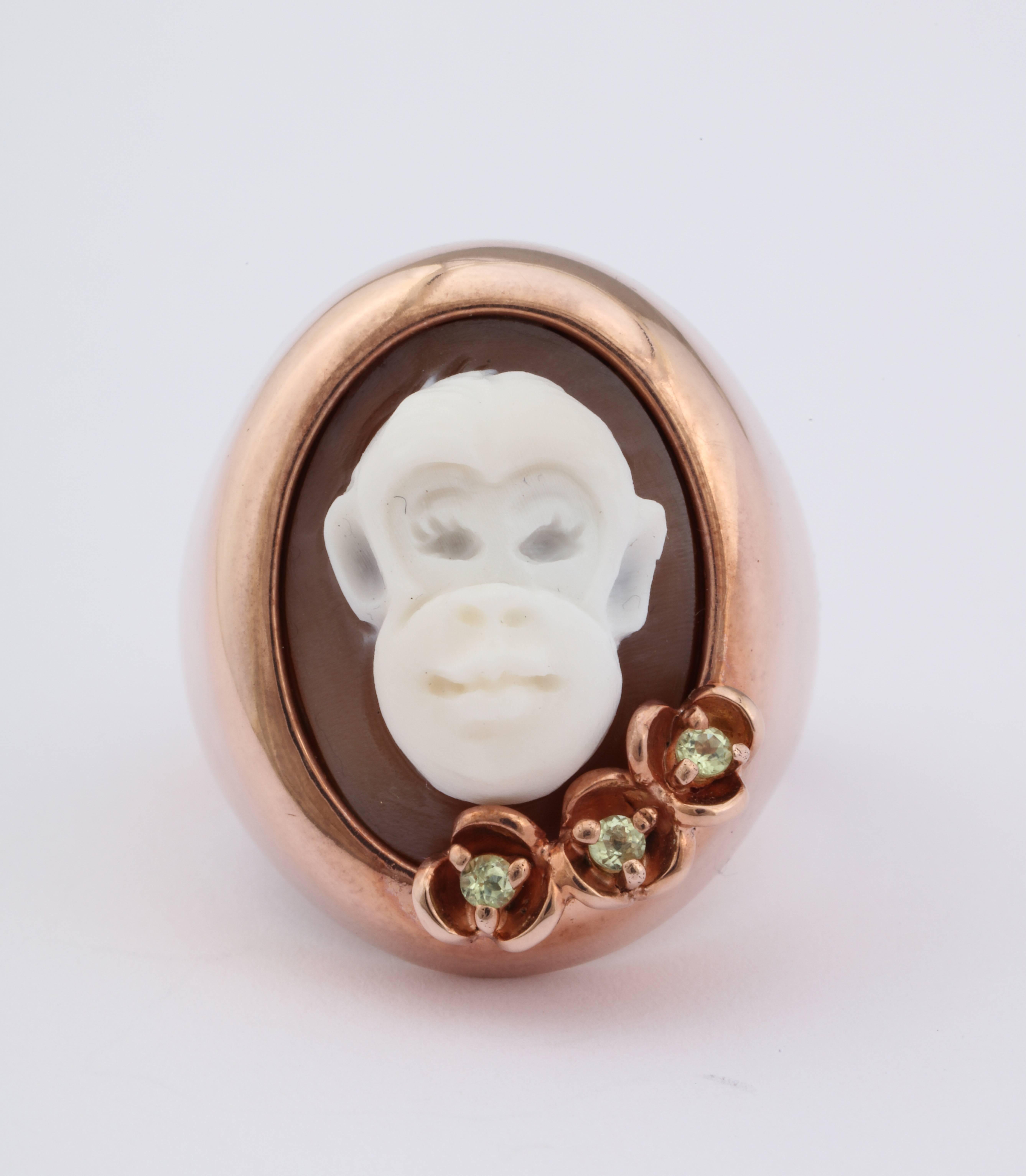 18mm Sardonyx shell cameo hand-carved set in sterling silver, rose rhodium platted and peridots.
Ring Size: US7

*Being these are hand crafted one of a kind designs, not all ring sizes might be immediately available. We offer custom sizing free of