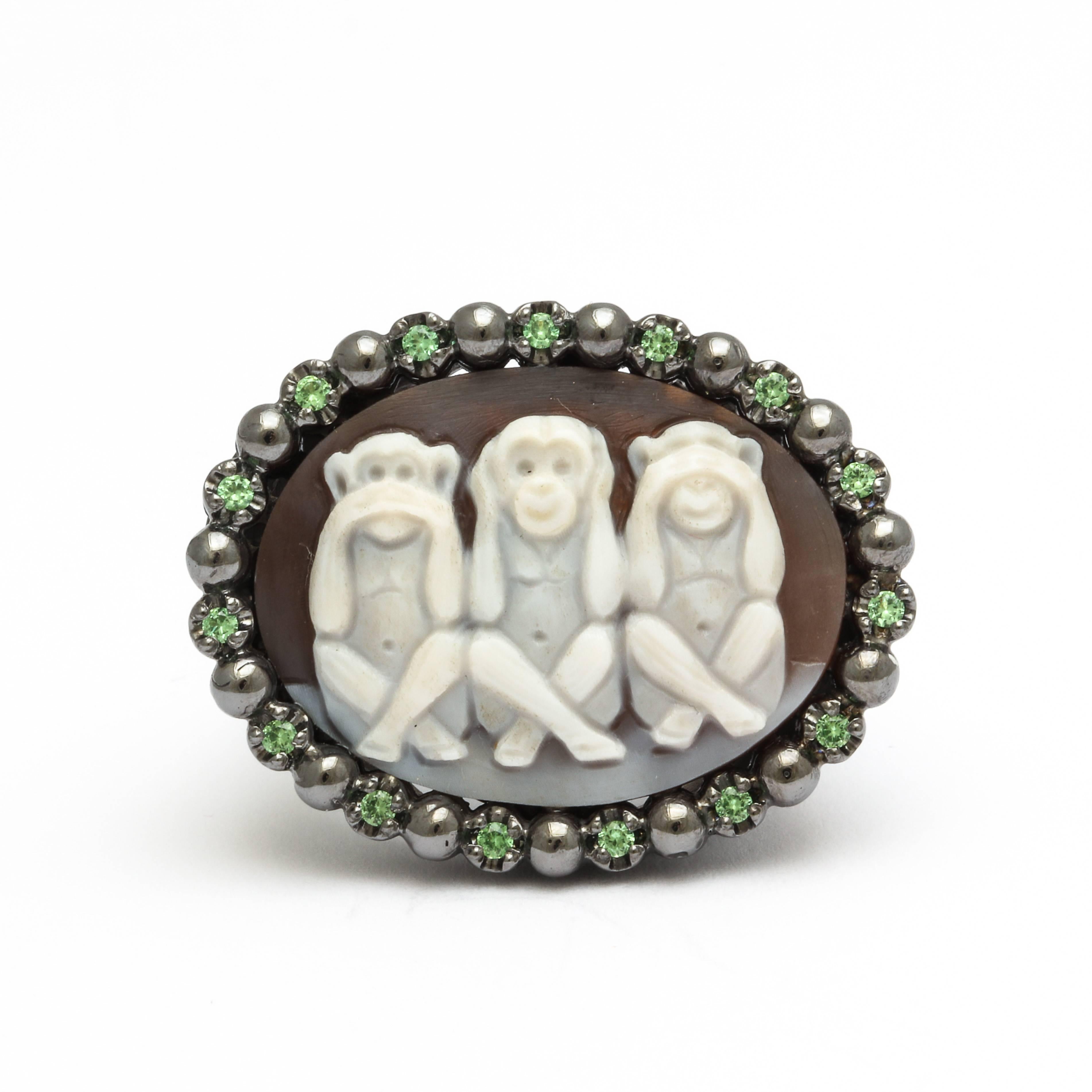 25mm sardonyx cameo hand-carved, set in sterling silver black rhodium plated ring with tsavorites.
Ring Size: 7.5US
*Being these are hand crafted one of a kind designs, not all ring sizes might be immediately available. We offer custom sizing free