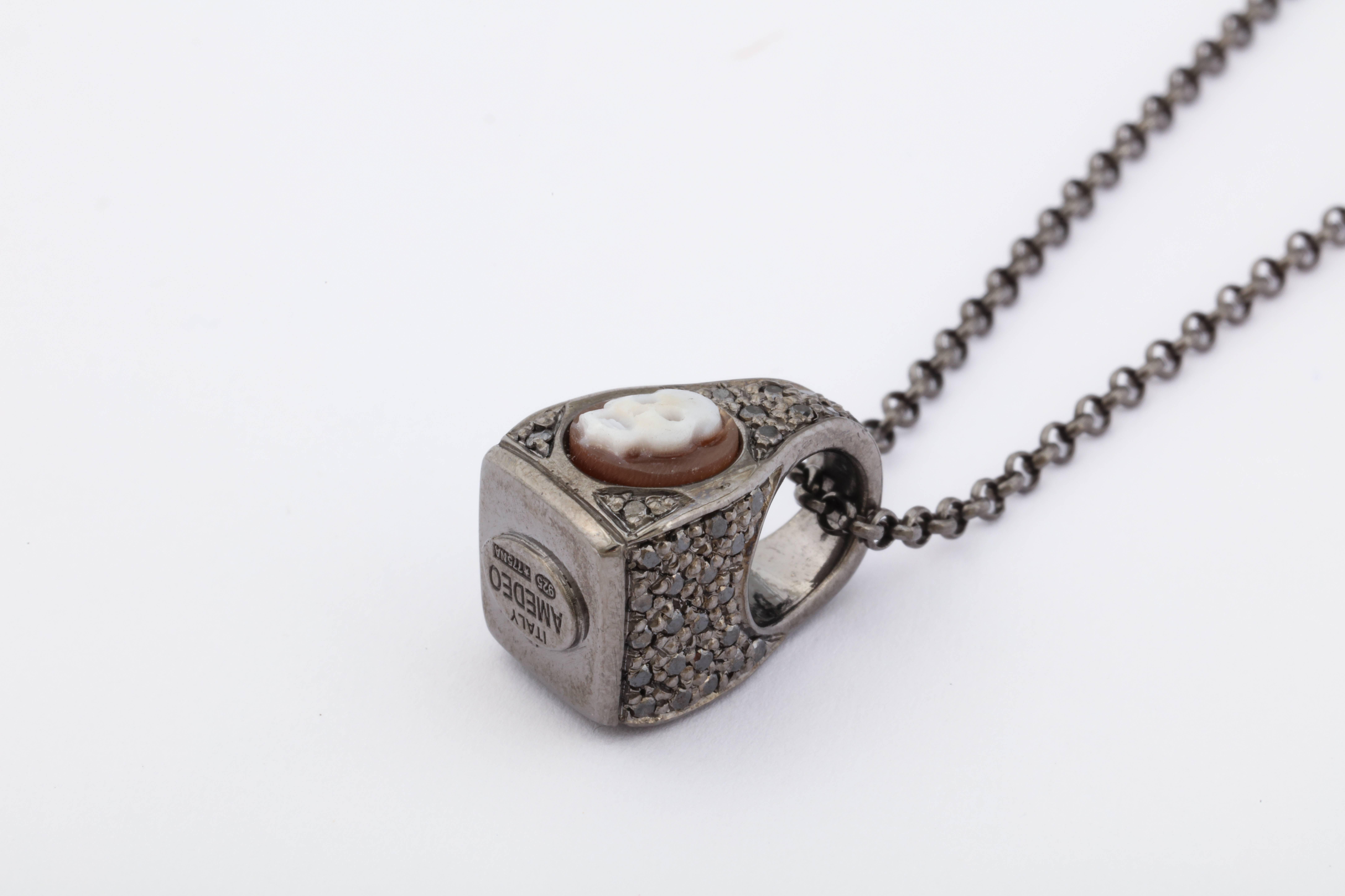 6mm sardonyx cameo shell, hand-carved set in sterling silver black rhodium plated and black diamonds.