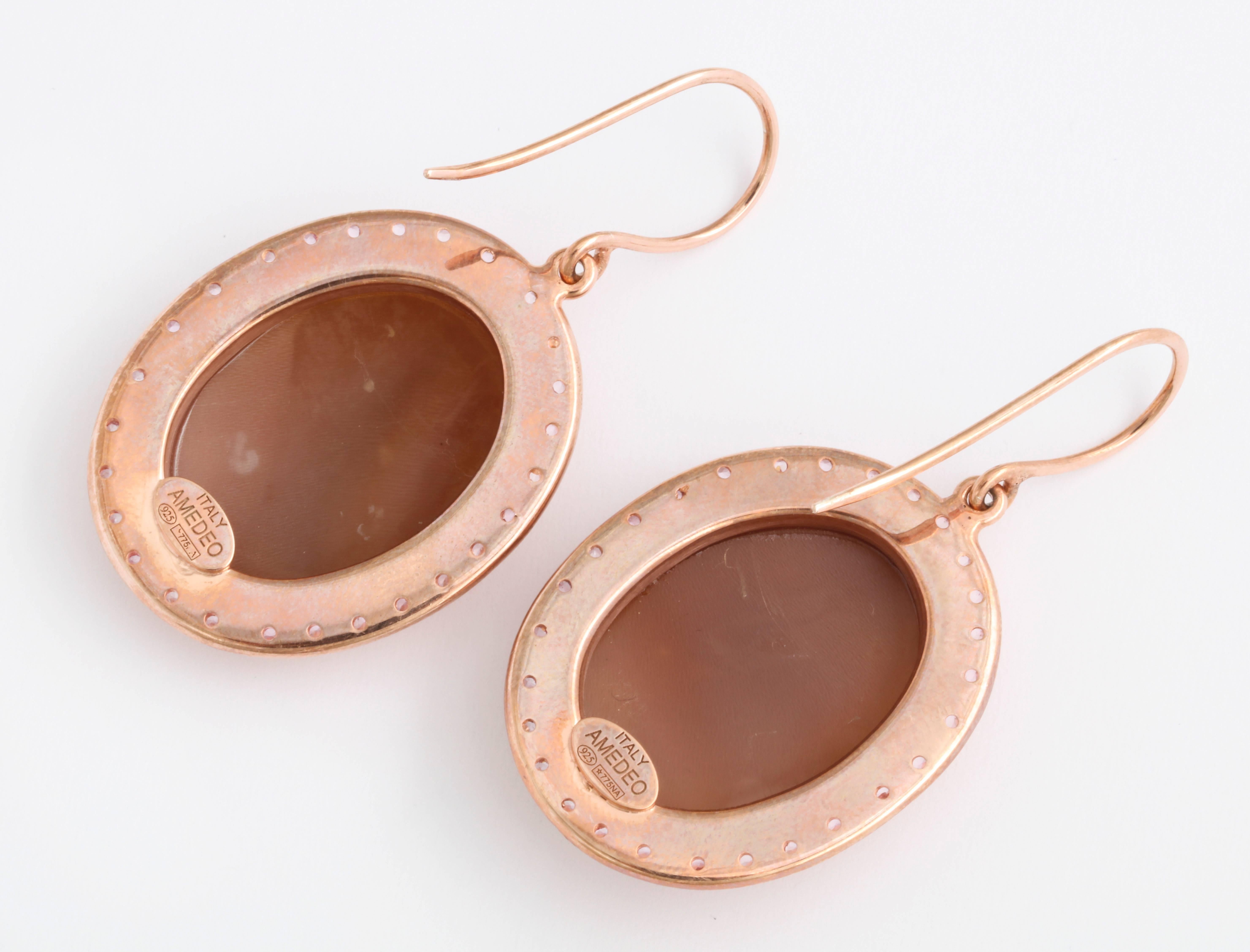 25mm sardonyx shell cameos hand-carved set in sterling silver rose rhodium plated earrings with rose sapphires.