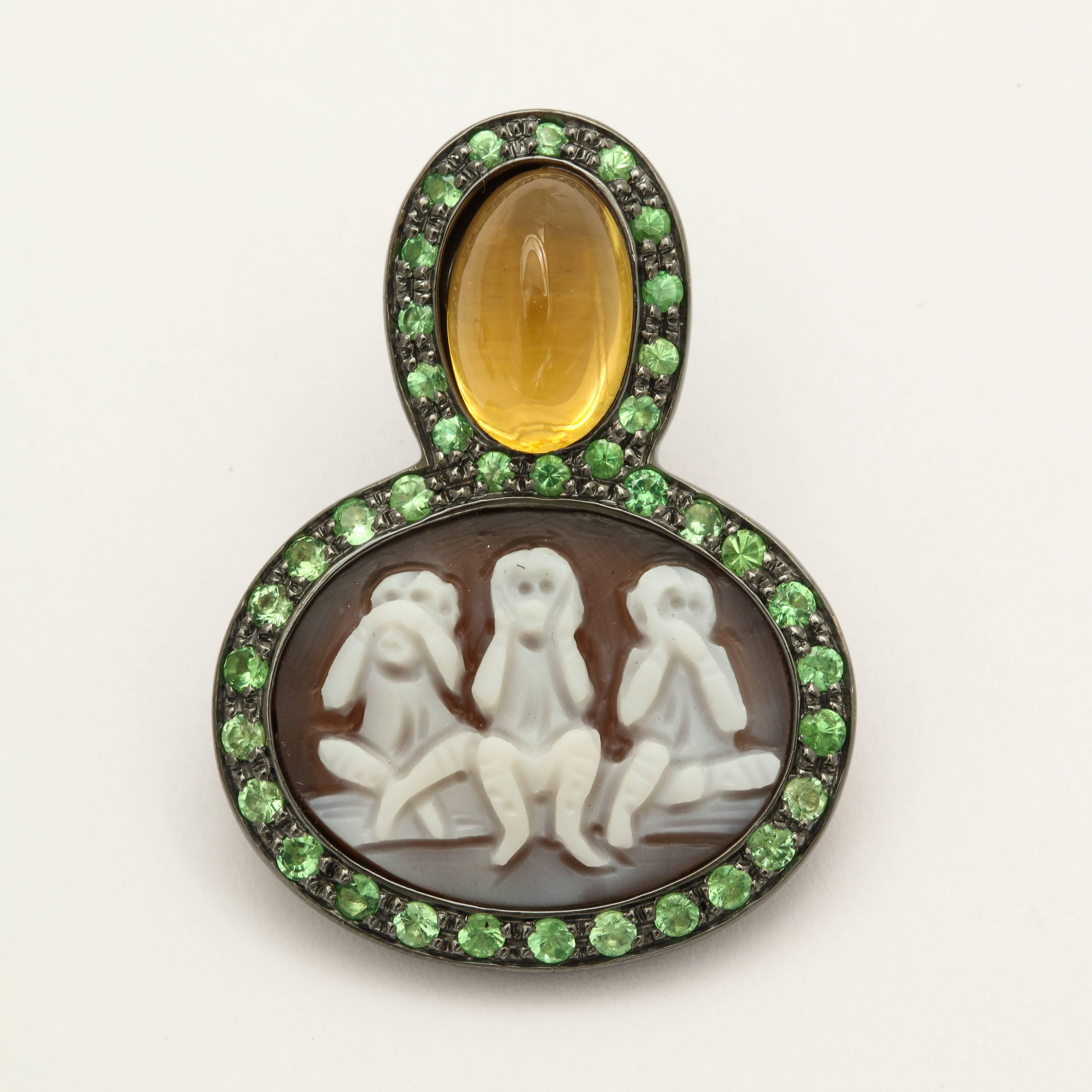 20mm sardonyx shell cameo hand-carved, set in sterling silver, black rhodium plated with 1.71ct tsavorites and 6.36ct citrine. 