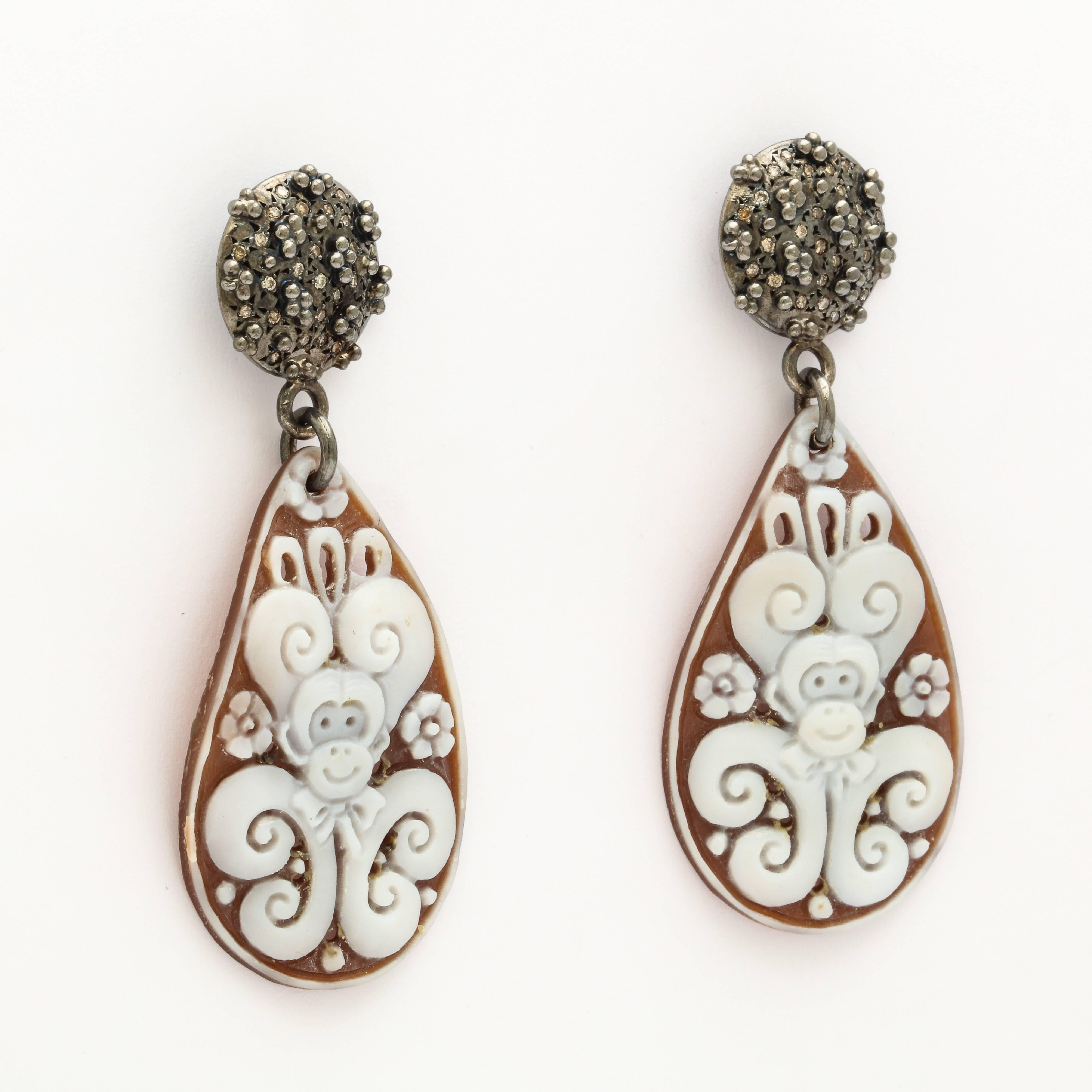 40mm sardonyx cameo hand-carved, set in sterling silver black rhodium plated  with brown diamonds.