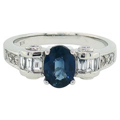 1.45 Carat Oval Blue Sapphire Baguette Diamond Cocktail Ring in 18K White Gold