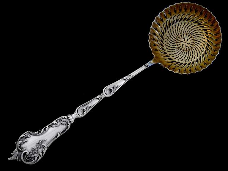SOUFFLOT Gorgeous French All Sterling Silver Vermeil Sugar Sifter Spoon Rococo

A rare sugar sifter spoon of truly exceptional quality, for the richness of Rococo pattern. Vermeil bowl and handle are decorated with foliage and flowers. No