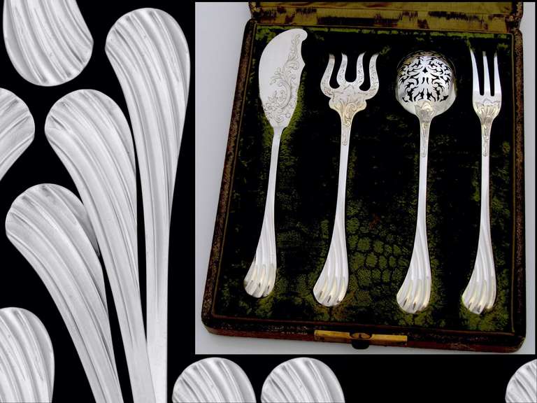 Gorgeous French All Sterling Silver Hors d'Oeuvre Set 4 pc w/original box

A set of truly high quality includes a knife, a pierced spoon, a three-pronged fork and four-pronged fork.  The upper parts are engraved with foliage decoration, the stems