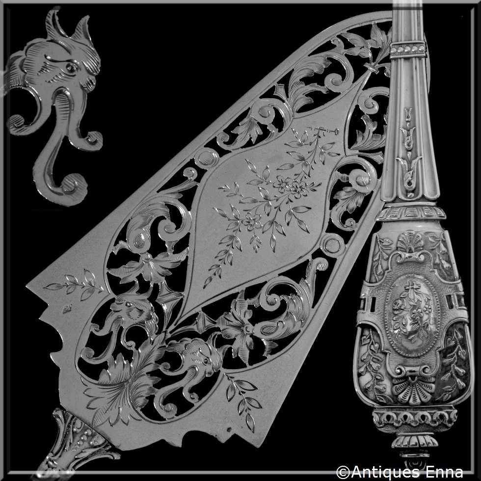 Richly Ornate French All Sterling Silver Pie/Pastry/Fish Server Renaissance

Boar's head mark for 800/1000 Sterling Silver guarantee.

The pierced blade is engraved with floral and foliate decoration and the handle has Renaissance-style. A piece