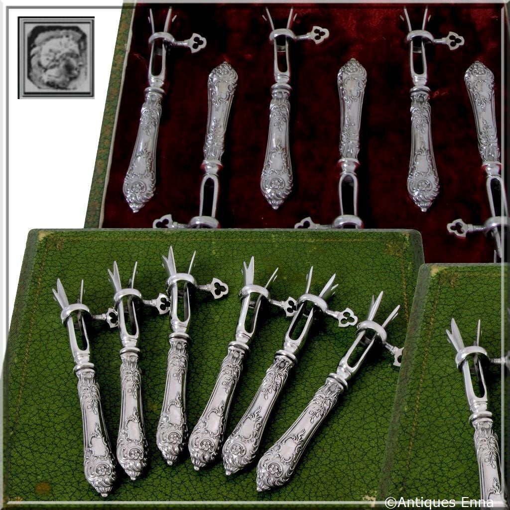 Gorgeous French Sterling Silver Cutlet Holders Set 6 pc original box Rococo

Head of Minerve 2nd titre on the handles for 800/1000 French Sterling Silver guarantee

The design and workmanship of this set is exceptional. The grip is silver-plated